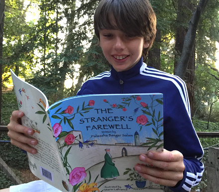 Boy reading the book The Stranger's Farewell